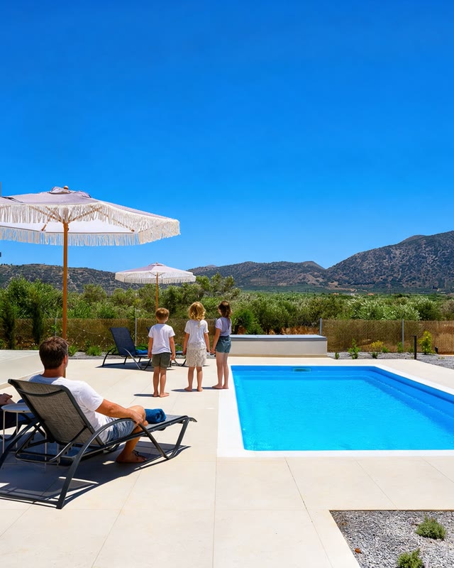 A family at the Villa Domingo pool in the afternoon sun
